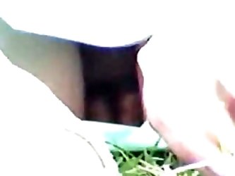 A Hidden Camera Voyeur Video Of An Upskirt View From A College Girl Sitting In A Park Without Panties Under Her Short Green Skirt. She Keeps Changing 